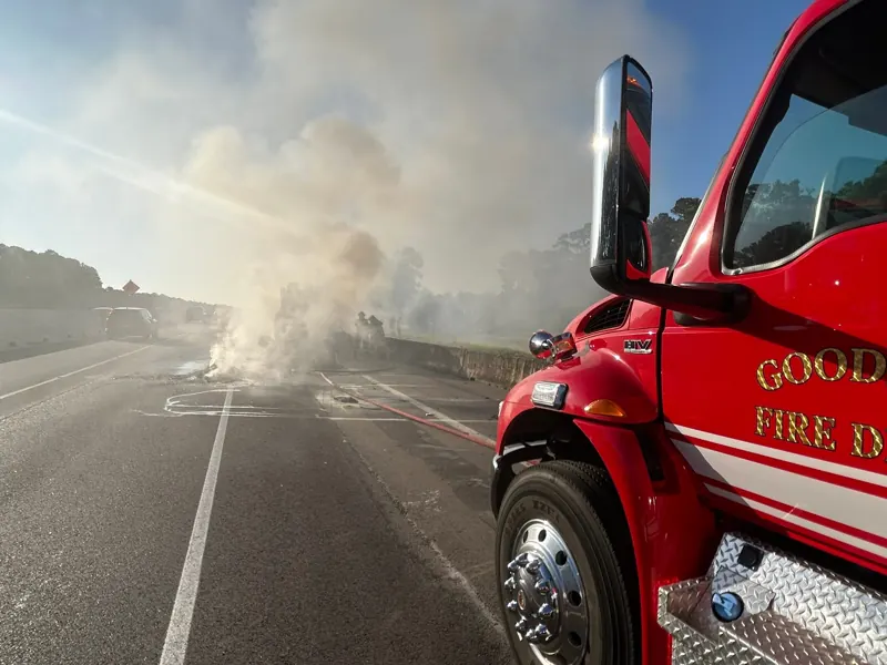 A Goodbee engine blocking the highway beside heavy smoke