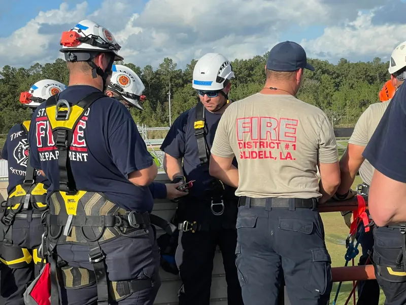 Rescuers from several departments rigging rope systems