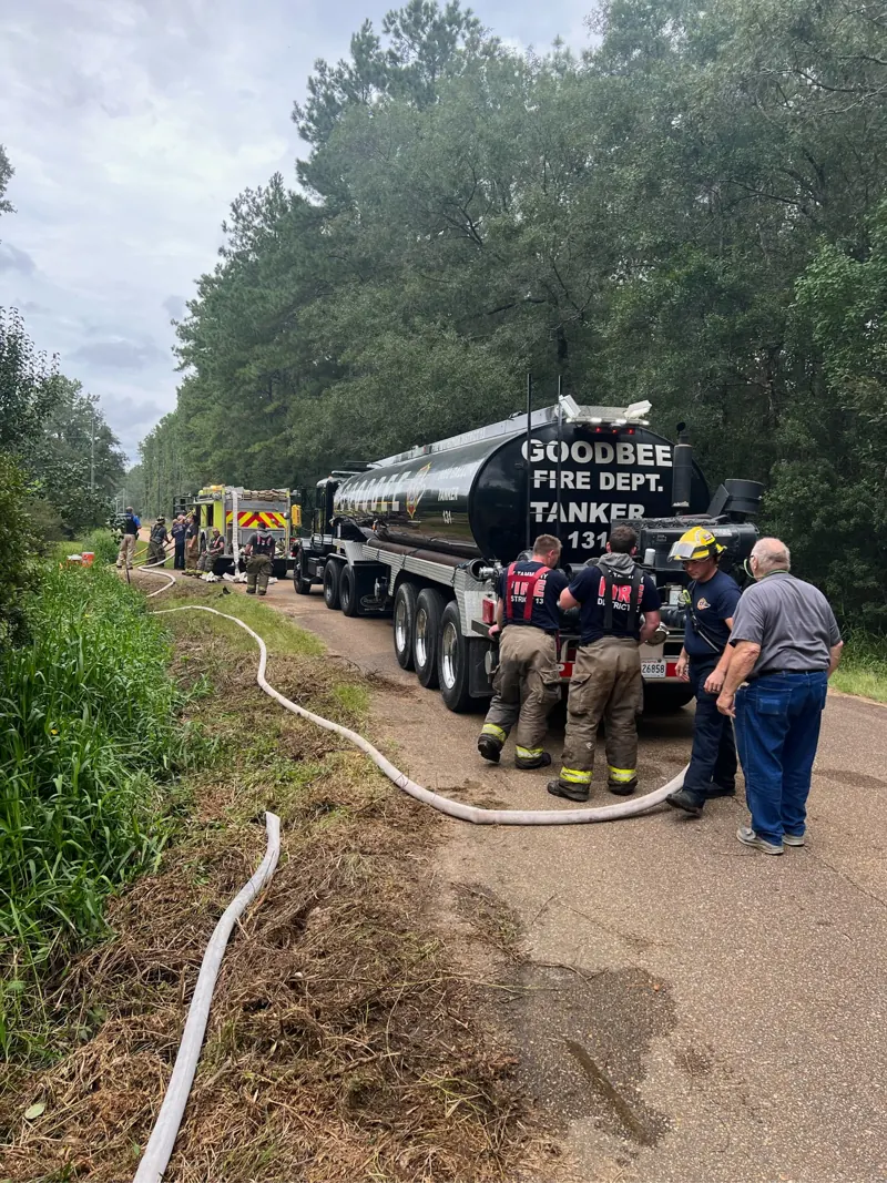 The Goodbee tanker supplying water on a rural road