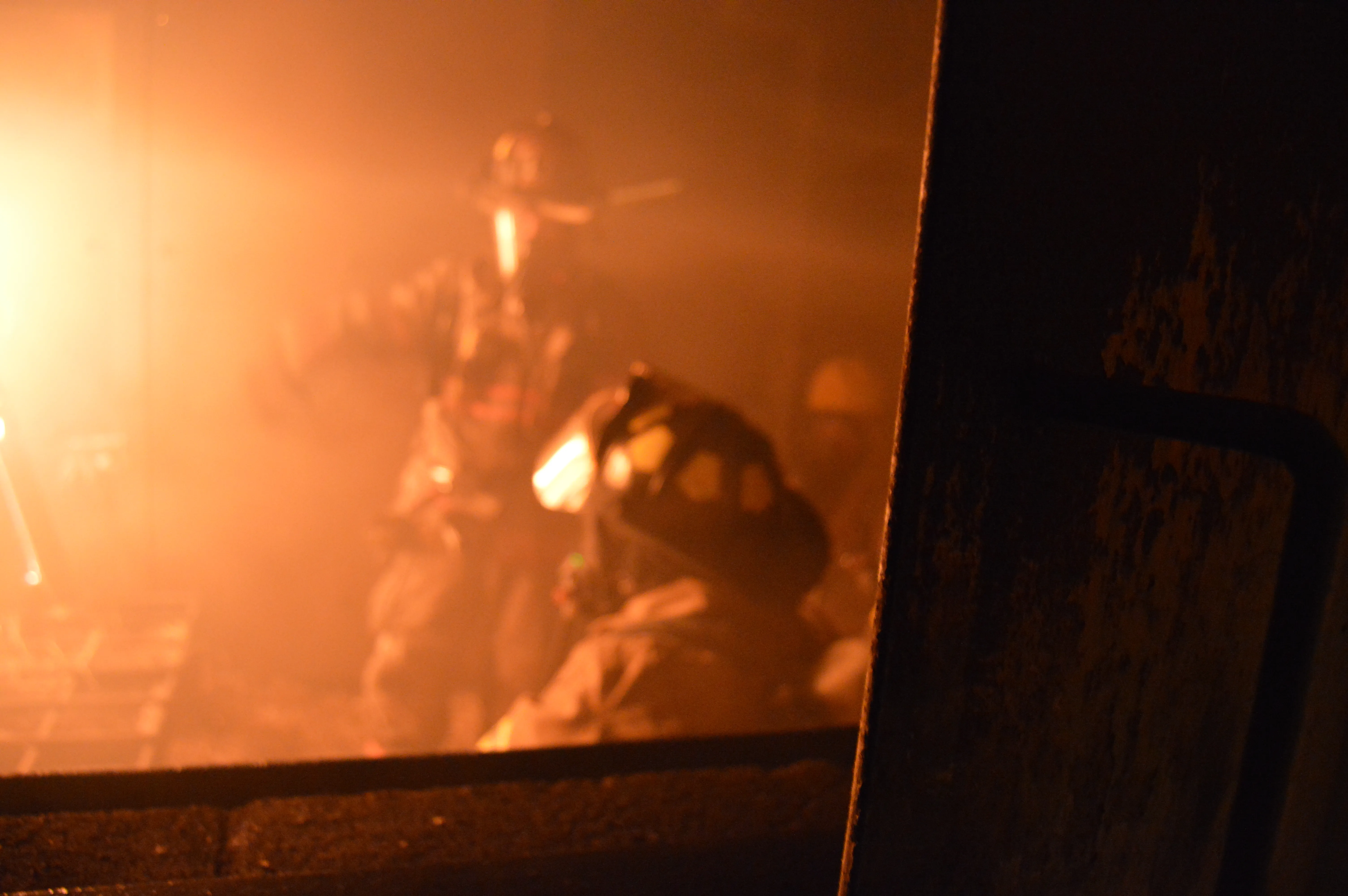 Firefighters working in heavy smoke